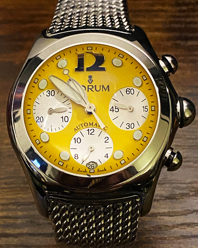 Corum Bubble 45MM Yellow Dial Steel Bracelet (285.150.20)