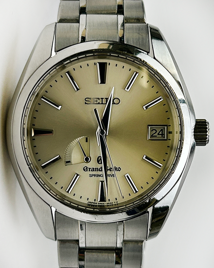Grand Seiko Spring Drive 40MM Champagne Dial Steel Bracelet (SBGA001)