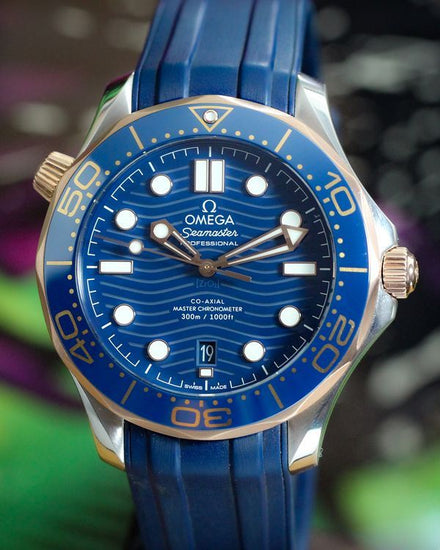 No Reserve - 2025 Omega Seamaster Diver 300M Sedna Gold 42MM Blue Dial Rubber Strap (210.22.42.20.03.002)